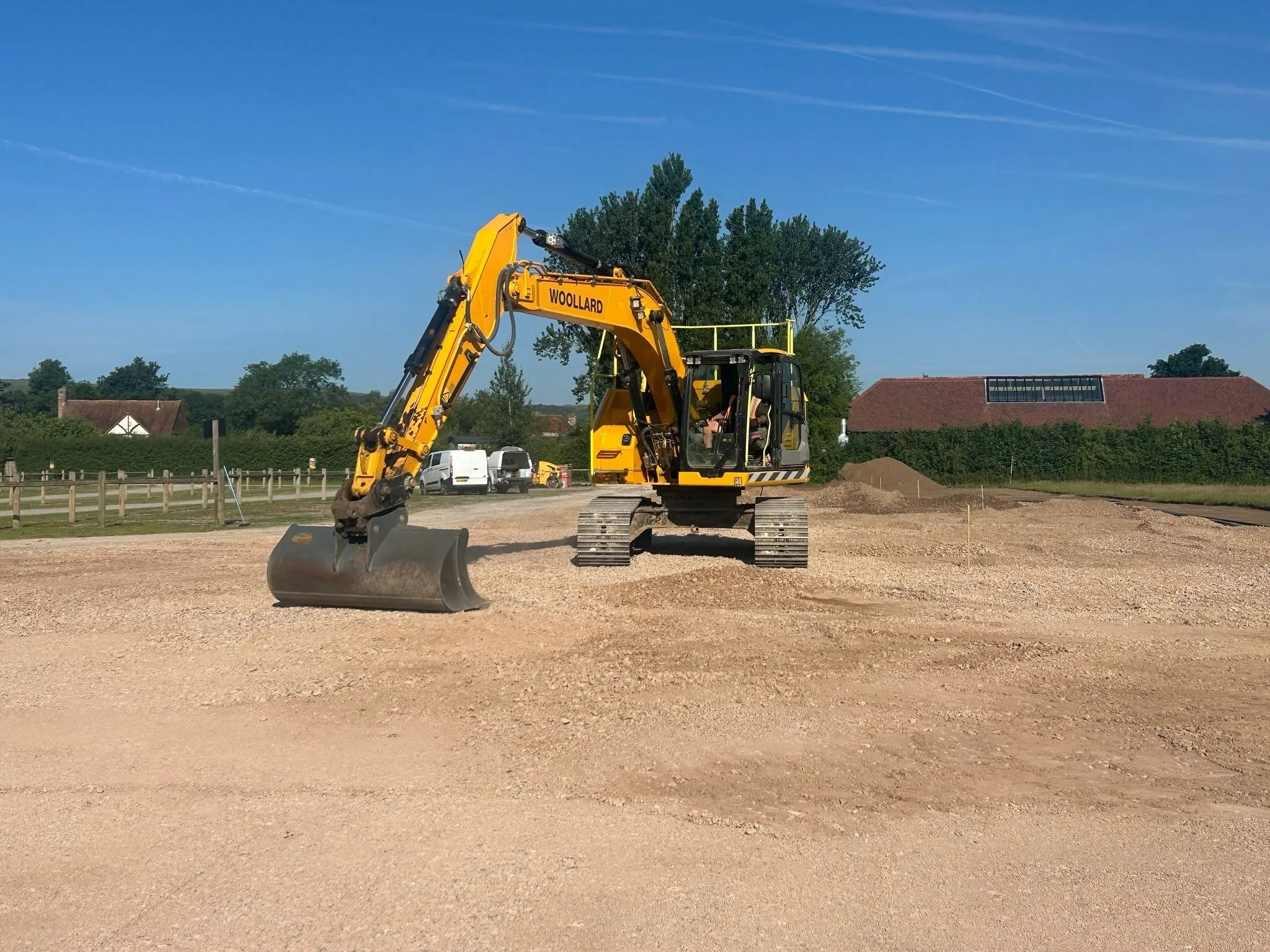 Woollard tracked excavator standing on a newly prepared aggregate surface